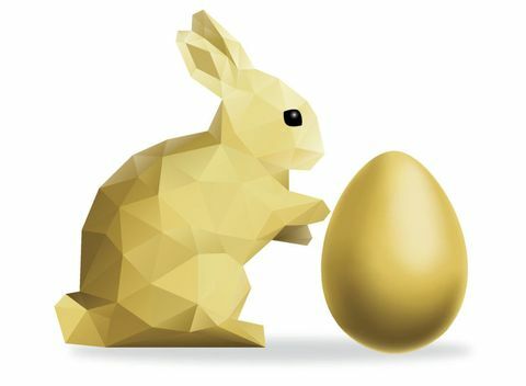 Zajček z nizkim polijem z zlatim velikonočnim jajcem